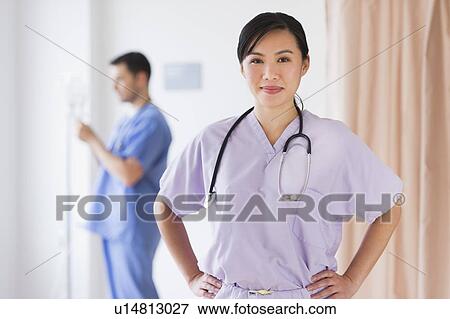Stock Photo - Doctor and nurse in hospital. Fotosearch