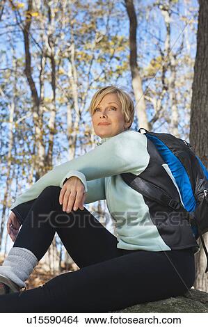 Female hiker resting in forest View Large Photo Image Picture - Female hiker resting in forest. Fotosearch