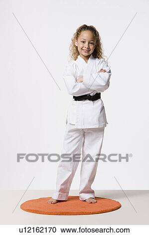 Girl (8-9) wearing gi, studio shot View Large Photo Image Stock Image - Girl (8-9) wearing gi, studio shot. Fotosearch