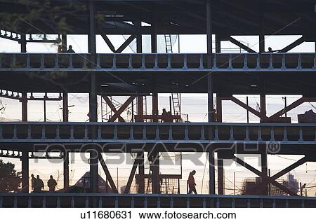 Group oaf construction workers working on unfinished structure View Large Photo Image Stock Image - Group oaf construction workers working on unfinished structure. Fotosearch
