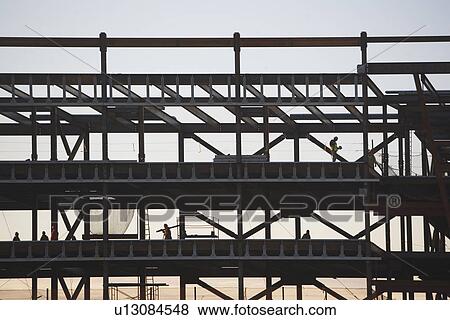 Group oaf construction workers working on unfinished structure View Large Photo Image Stock Photo - Group oaf construction workers working on unfinished structure. Fotosearch