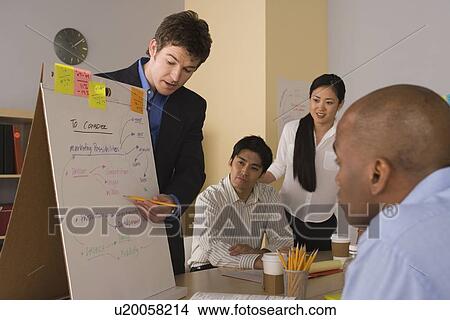 Group of businesspeople in meeting View Large Photo Image Picture - Group of businesspeople in meeting. Fotosearch