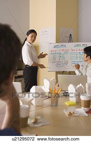 Group of businesspeople in meeting View Large Photo Image Stock Image - Group of businesspeople in meeting. Fotosearch
