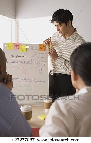 Stock Photo - Group of businesspeople in meeting. Fotosearch