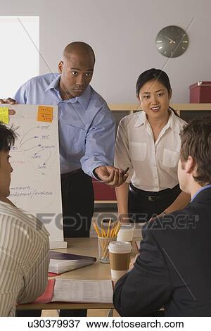 Group of businesspeople in meeting View Large Photo Image Stock Photo - Group of businesspeople in meeting. Fotosearch