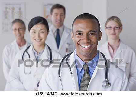 Group portrait of smiling doctors View Large Photo Image Stock Image - Group portrait of smiling doctors. Fotosearch