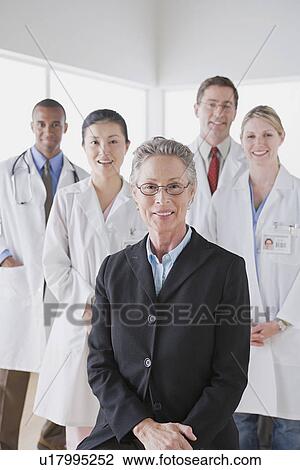 Group portrait of smiling doctors View Large Photo Image Stock Image - Group portrait of smiling doctors. Fotosearch