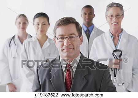 Group portrait of smiling doctors View Large Photo Image Stock Image - Group portrait of smiling doctors. Fotosearch