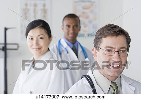 Group portrait of smiling doctors View Large Photo Image Stock Photo - Group portrait of smiling doctors. Fotosearch