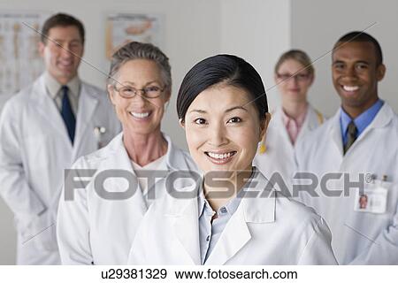 Group portrait of smiling doctors View Large Photo Image Stock Photo - Group portrait of smiling doctors. Fotosearch