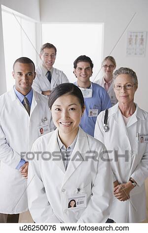 Stock Photograph - Group portrait of smiling doctors. Fotosearch