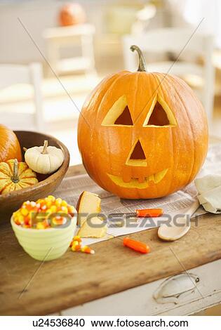 Halloween pumpkin on table View Large Photo Image Stock Image - Halloween pumpkin on table. Fotosearch