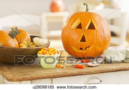Halloween pumpkin on table View Large Photo Image Stock Photography - Halloween pumpkin on table. Fotosearch