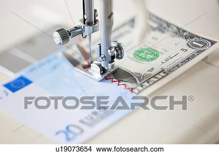 Halves of banknotes being sewed with sewing machine View Large Photo Image Picture - Halves of banknotes being sewed with sewing machine. Fotosearch
