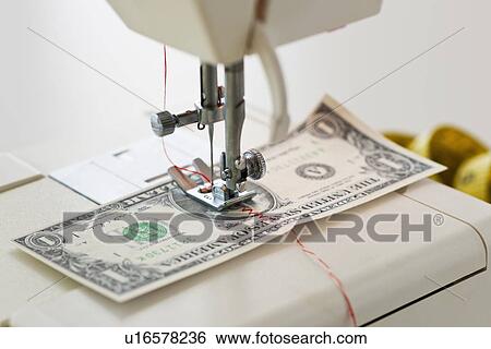 Halves of dollar bill being sewed with sewing machine View Large Photo Image Stock Photograph - Halves of dollar bill being sewed with sewing machine. Fotosearch