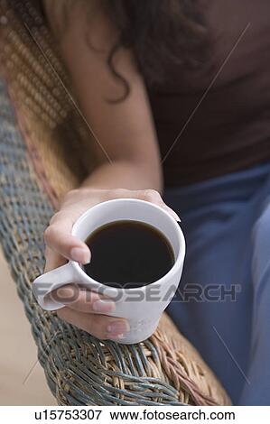 Hand holding cup of coffee View Large Photo Image Stock Photo - Hand holding cup of coffee. Fotosearch