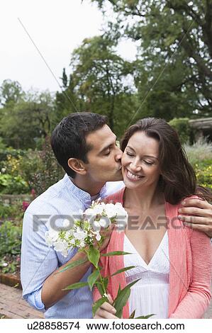 Happy couple in garden View Large Photo Image Picture - Happy couple in garden. Fotosearch