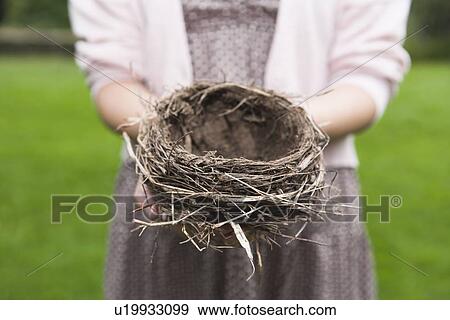 Happy woman standing on stone wall on field View Large Photo Image Stock Photo - Happy woman standing on stone wall on field. Fotosearch