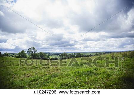 Stock Photograph - Ireland, County Westmeath, Landscape with clouds. Fotosearch