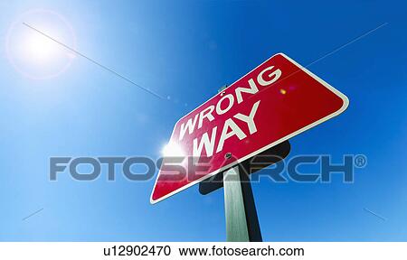 Stock Image - Low angle view of "wrong way" sign. Fotosearch