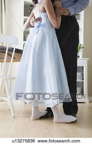 Low section of Father and Daughter (10-11) dancing in kitchen View Large Photo Image Stock Photograph - Low section of Father and Daughter (10-11) dancing in kitchen. Fotosearch