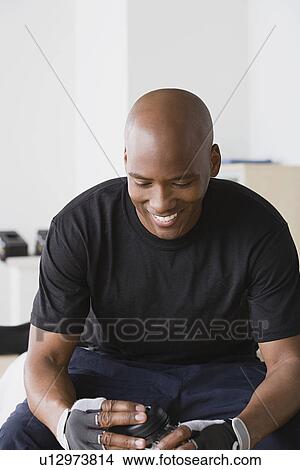 Male athlete smiling in gym View Large Photo Image Picture - Male athlete smiling in gym. Fotosearch