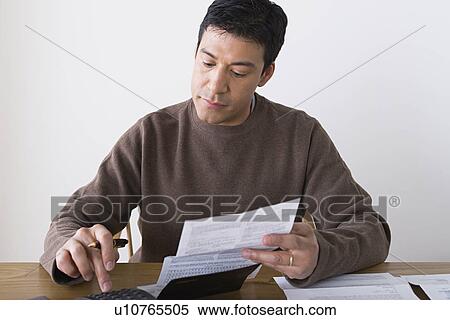 Man doing paperwork View Large Photo Image Stock Photography - Man doing paperwork. Fotosearch
