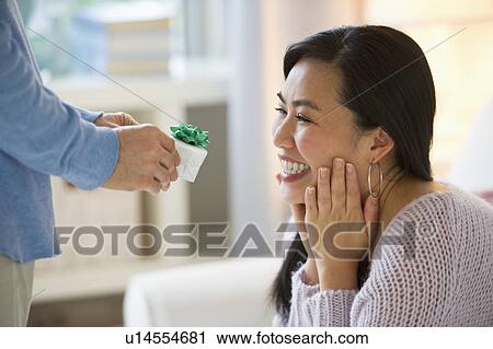 Man giving to woman engagement ring View Large Photo Image Stock Image - Man giving to woman engagement ring. Fotosearch