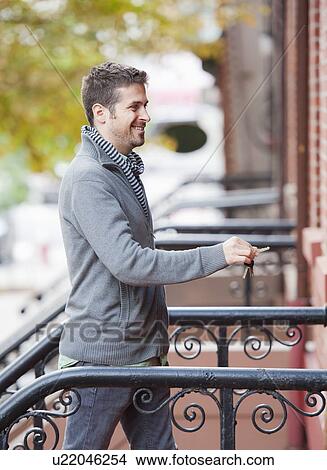 Man opening house View Large Photo Image Picture - Man opening house. Fotosearch
