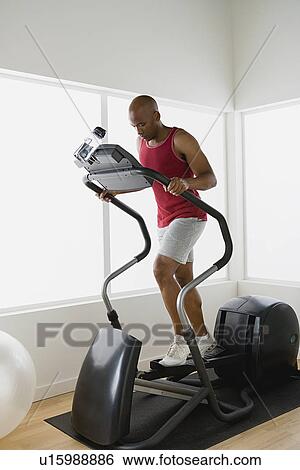 Man running on trademill View Large Photo Image Stock Photograph - Man running on trademill. Fotosearch