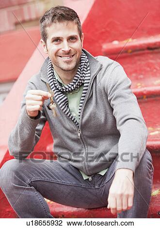 Man sitting on steps View Large Photo Image Stock Image - Man sitting on steps. Fotosearch