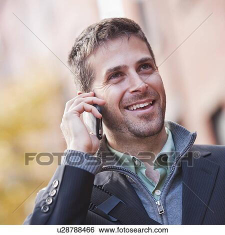 Man talking on mobile phone View Large Photo Image Stock Photograph - Man talking on mobile phone. Fotosearch