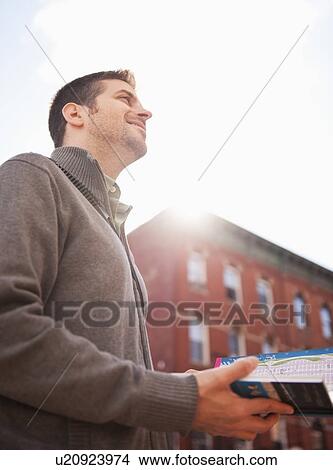 Man visiting city with city map View Large Photo Image Picture - Man visiting city with city map. Fotosearch