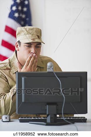 Man wearing military uniform blowing kiss to monitor View Large Photo Image Stock Image - Man wearing military uniform blowing kiss to monitor. Fotosearch