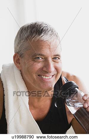 Mature athlete drinking water View Large Photo Image Stock Image - Mature athlete drinking water. Fotosearch