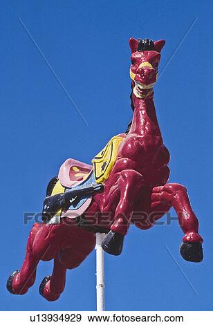 Stock Photo - Mexico, Carousel painted horse used as building decor. Fotosearch