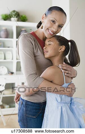 Mother and Daughter (10-11) hugging View Large Photo Image Stock Photo - Mother and Daughter (10-11) hugging. Fotosearch
