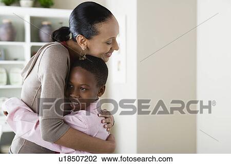 Mother and Son (12-13) hugging View Large Photo Image Stock Image - Mother and Son (12-13) hugging. Fotosearch