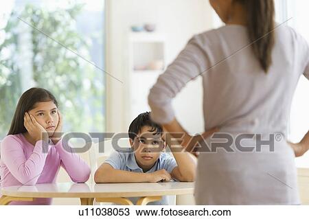 Stock Image - Mother angry on her children (10-11, 12-13). Fotosearch