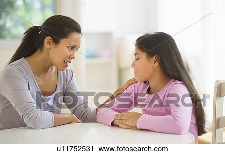 Mother with daughter (10-11) talking at home View Large Photo Image Stock Image - Mother with daughter (10-11) talking at home. Fotosearch