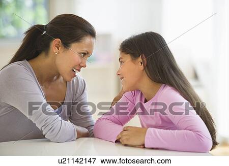 Mother with daughter (10-11) talking at home View Large Photo Image Stock Photo - Mother with daughter (10-11) talking at home. Fotosearch