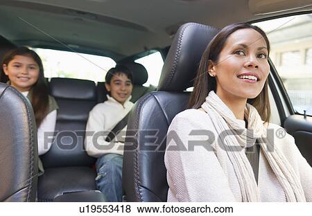 Mother with son (12-13) and daughter (10-11) in car View Large Photo Image Stock Photo - Mother with son (12-13) and daughter (10-11) in car . Fotosearch