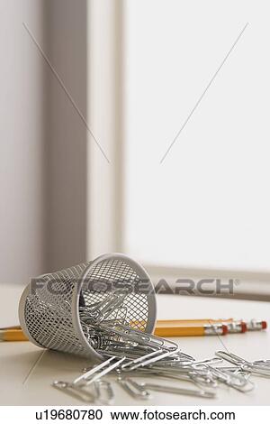 Paper clips pencils and small metal basket View Large Photo Image Stock Image - Paper clips pencils and small metal basket. Fotosearch