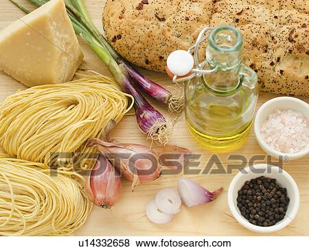 Stock Photo - Pasta, cheese, garlic and olive oil, studio shot. Fotosearch
