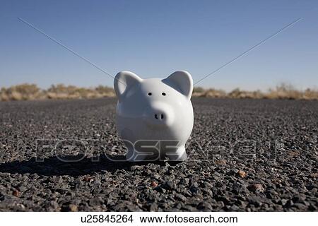 Piggy bank on asphalt road View Large Photo Image Picture - Piggy bank on asphalt road. Fotosearch