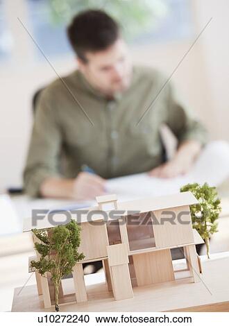 Stock Image - Portrait of architect working in office. Fotosearch