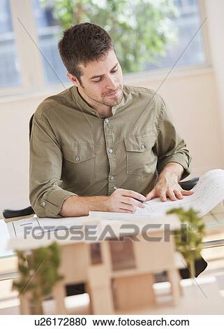 Portrait of architect working in office View Large Photo Image Stock Image - Portrait of architect working in office. Fotosearch