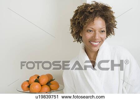Portrait of attractive woman with oranges in bowl View Large Photo Image Stock Image - Portrait of attractive woman with oranges in bowl. Fotosearch