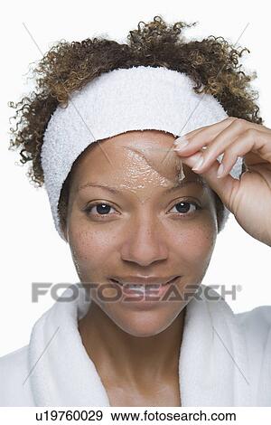 Portrait of attractive woman with facial mask View Large Photo Image Stock Photo - Portrait of attractive woman with facial mask. Fotosearch