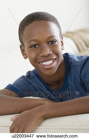 Stock Photo - Portrait of boy (12-13). Fotosearch
